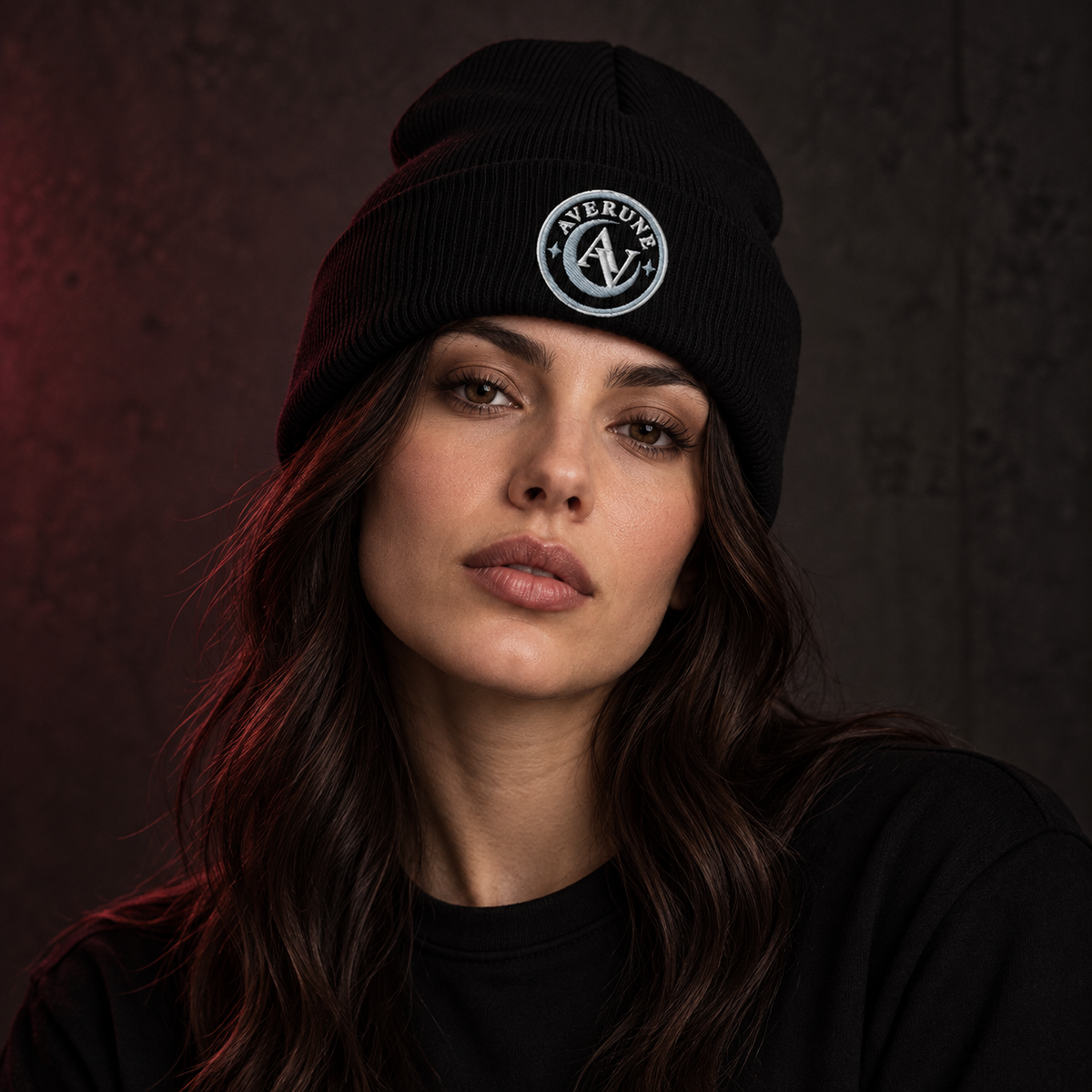 Female model wearing the black AVERUNE Signature Embroidered Beanie