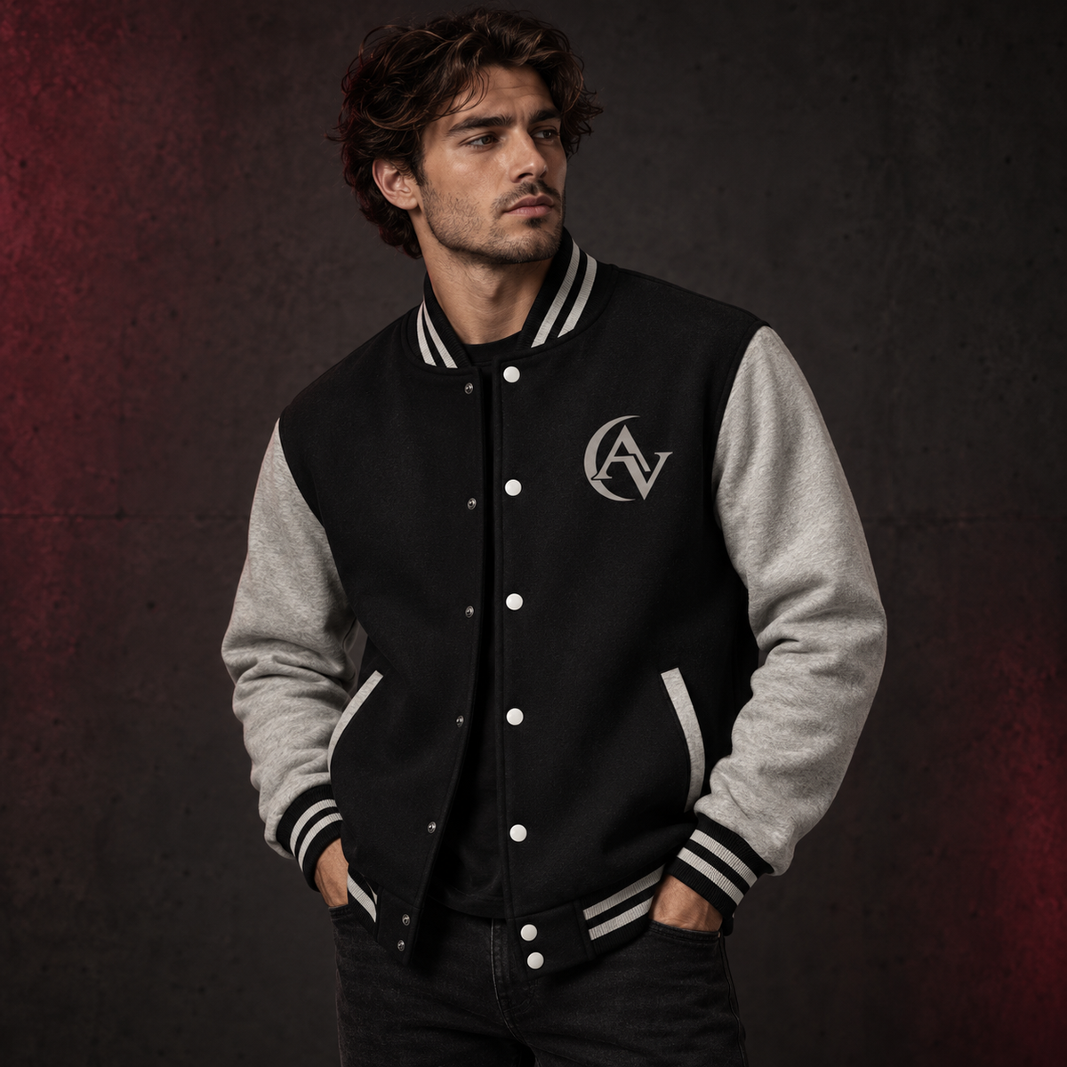 Male model wearing the black and grey AVERUNE Signature Varsity Jacket